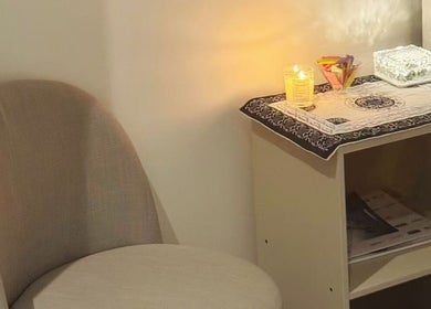 Warm, inviting treatment room at S&L Skins Beauty in Sydney, New South Wales, AU with soft lighting and cozy seating.