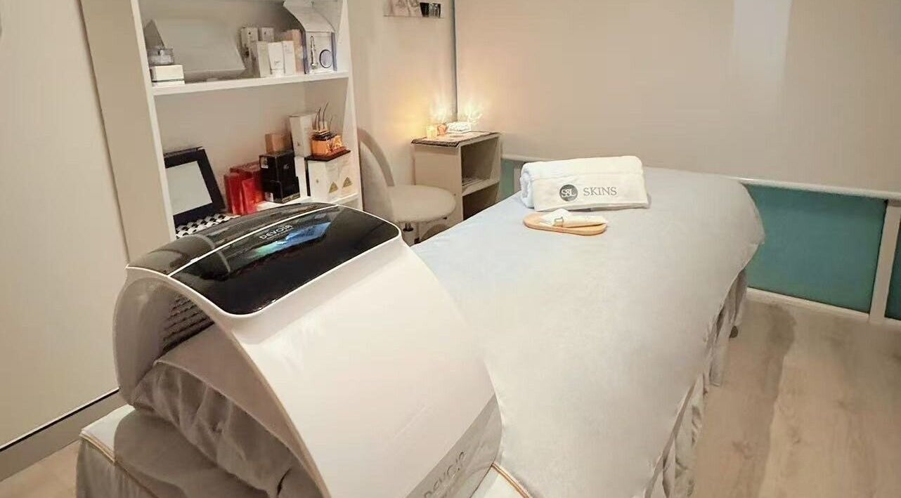 Relaxation room at S&L Skins Beauty in Sydney, New South Wales, AU with cozy treatment bed and ambient lighting.