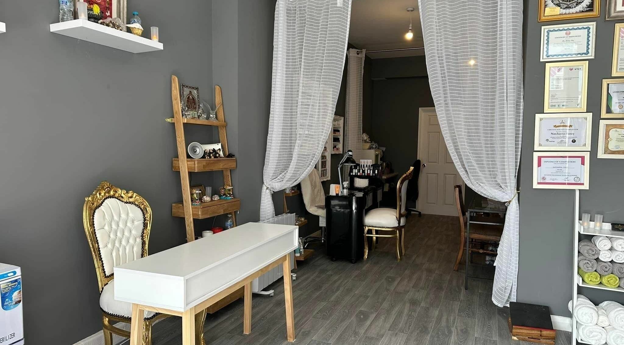 Elegant interior of Therapeutic Thai Massage & Nails Norwich, Norwich, England, GB with royal seating and decor.
