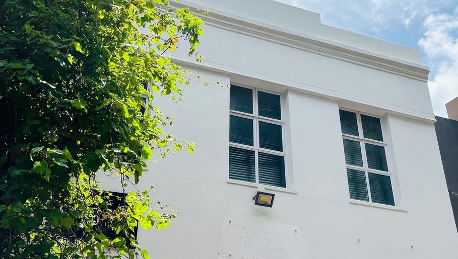 Exterior of Liliy Nails Beauty Studio in Cape Town, Western Cape, ZA with bright windows and greenery.