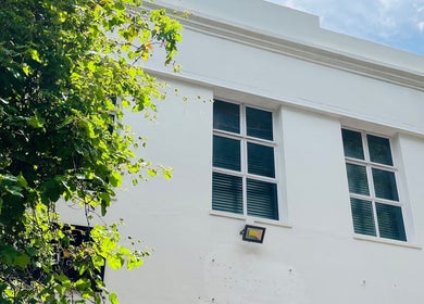 Exterior of Liliy Nails Beauty Studio in Cape Town, Western Cape, ZA with bright windows and greenery.