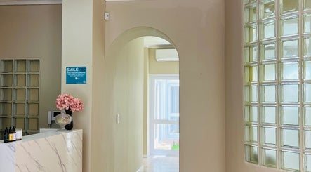 Elegant interior of Liliy Nails Beauty Studio in Cape Town, Western Cape, ZA. Features glass blocks and floral decor.