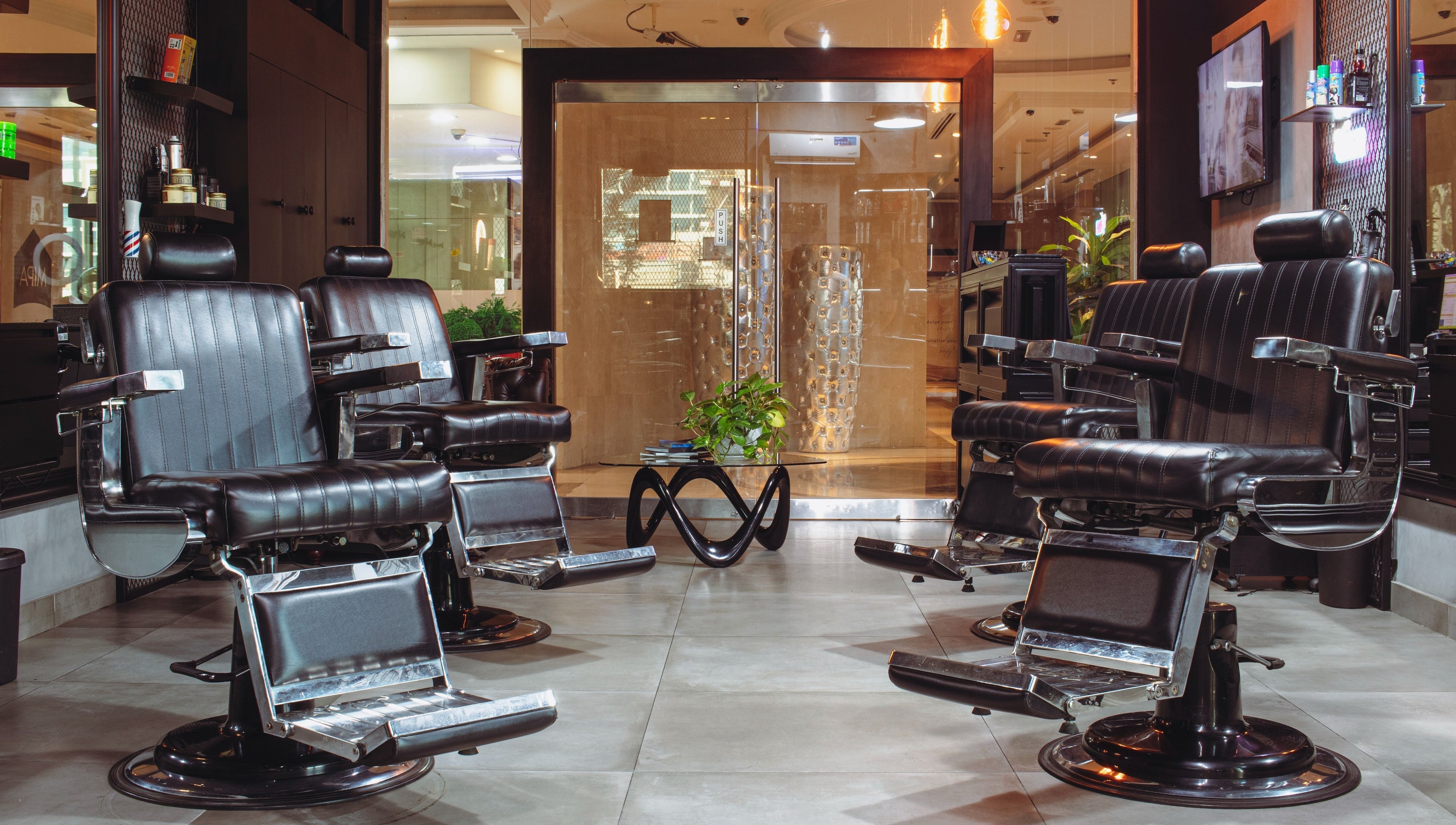 Modern barber chairs at The Crib Barbershop, a premier grooming venue in Arjan, Dubai, AE.