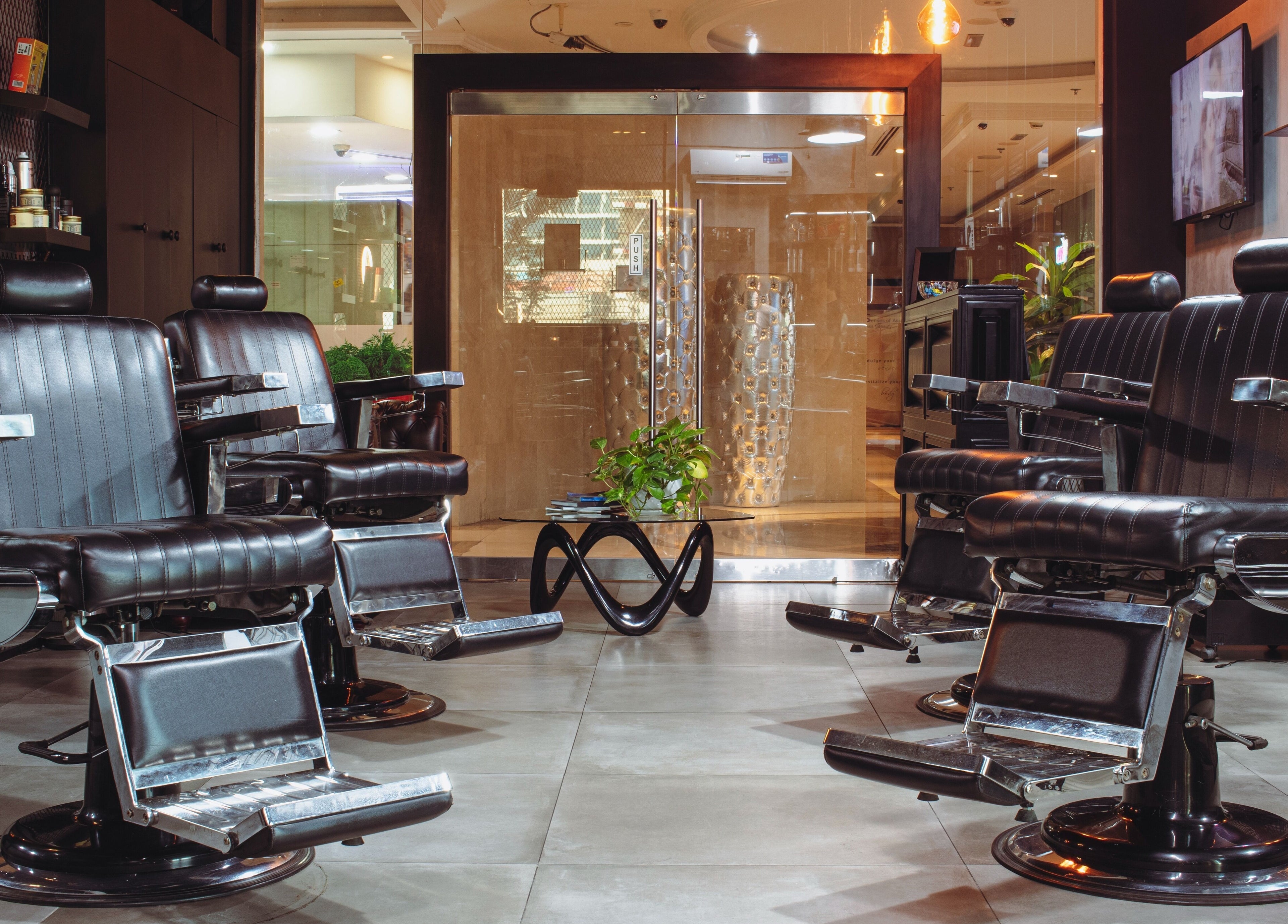 Modern barber chairs at The Crib Barbershop, a premier grooming venue in Arjan, Dubai, AE.