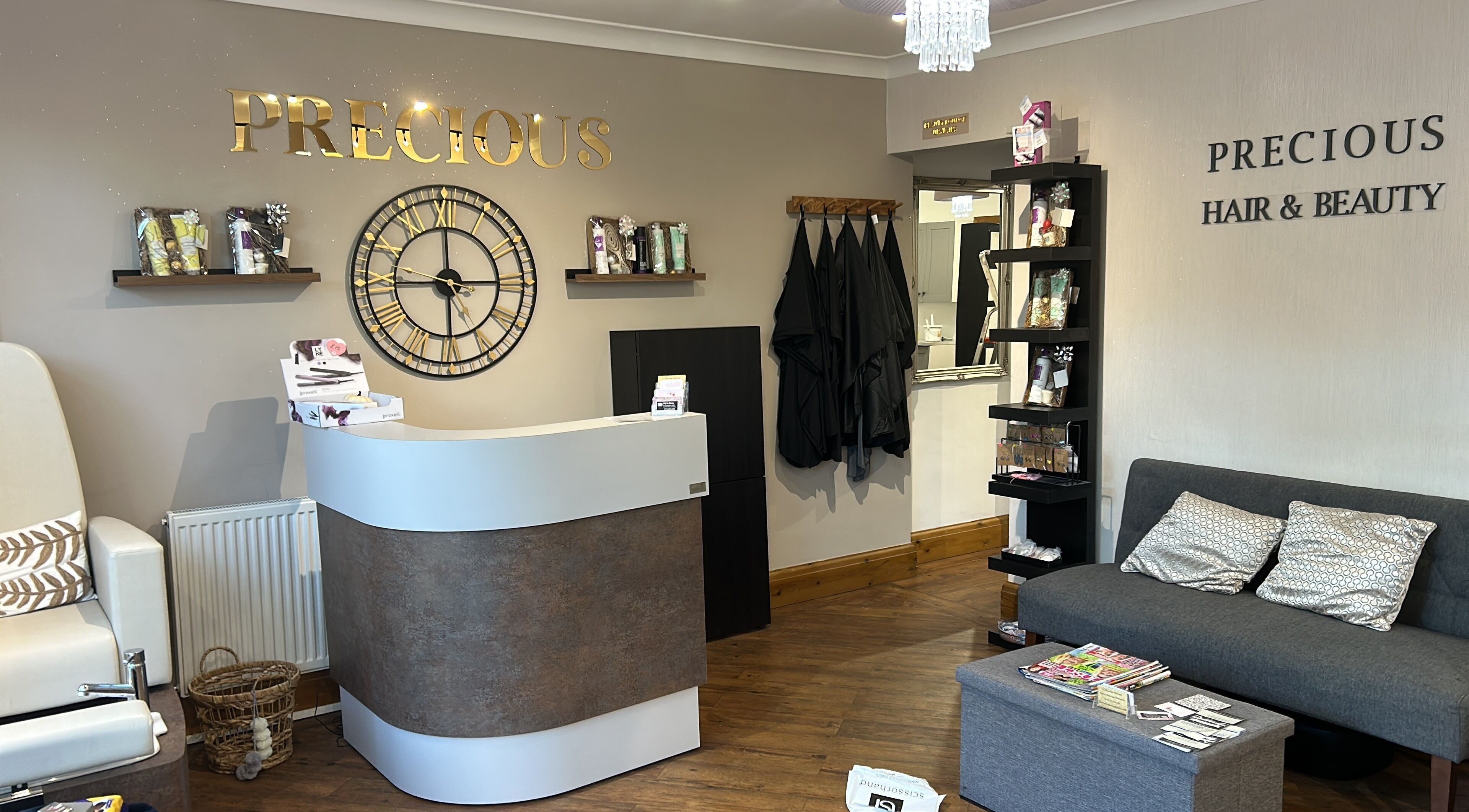 Chic lobby at Precious Hair and Beauty Lounge, Bingley, England, GB, with modern decor and comfy seating.