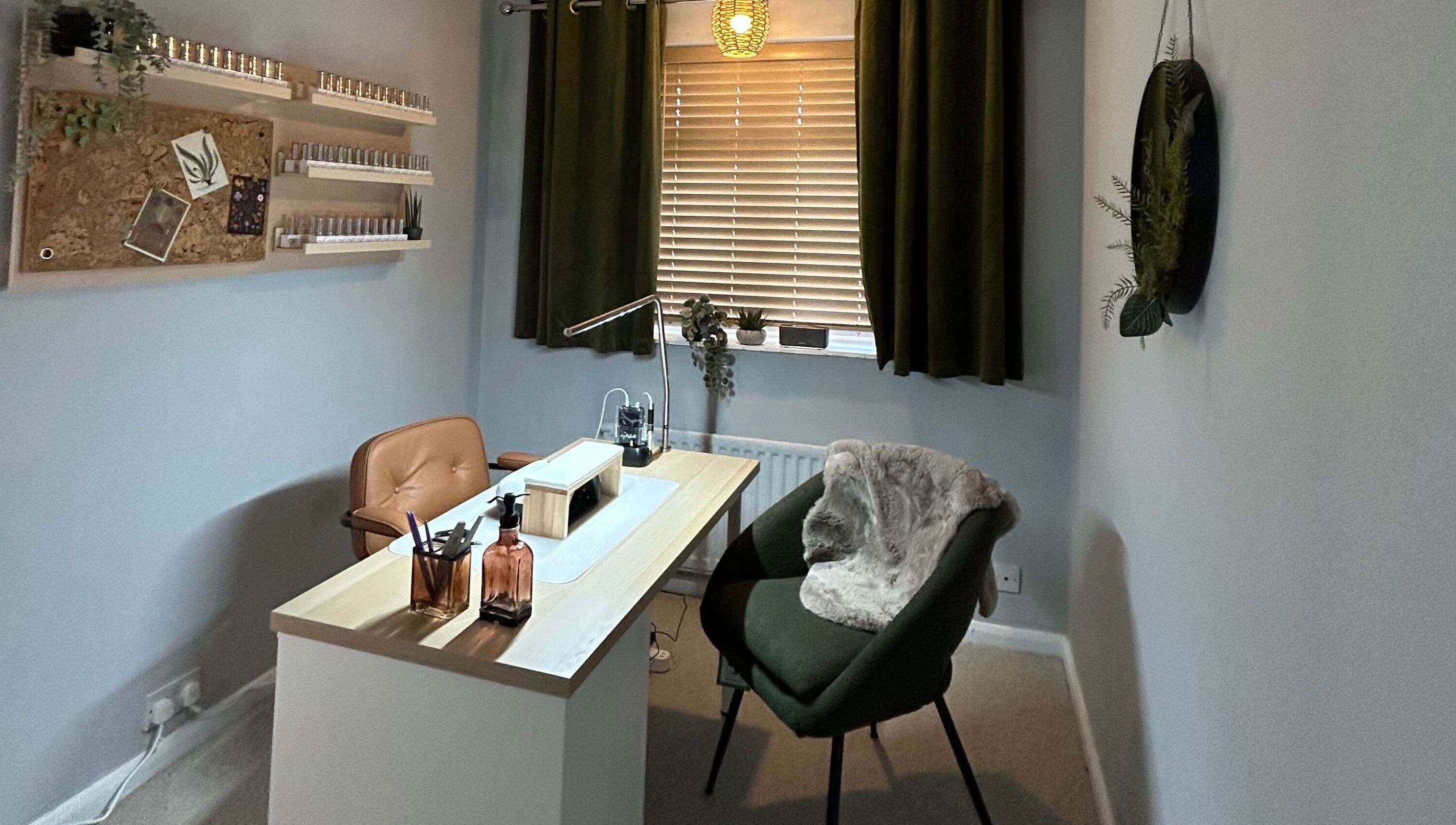 Modern nail salon interior at Nails with George, Horley, England, GB, featuring stylish chairs and decor.