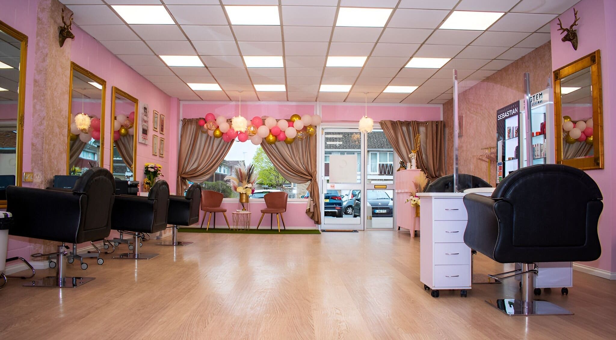 Elegant salon interior at Naturally U, Sittingbourne, England, GB, featuring chic decor and stylish seating.