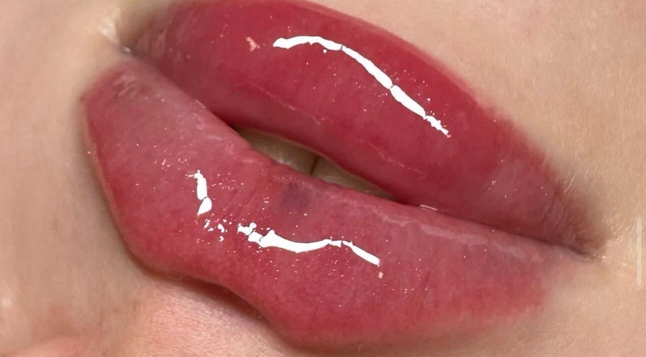 Close-up of glossy lips at Klaud’s Klub, Cliffe, England, GB showcasing vibrant makeup.