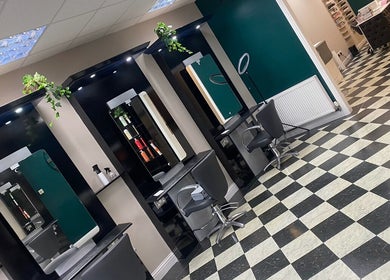 Elegant salon chairs and mirrors inside Ivy Hair & Beauty, Cowdenbeath, Scotland, GB.