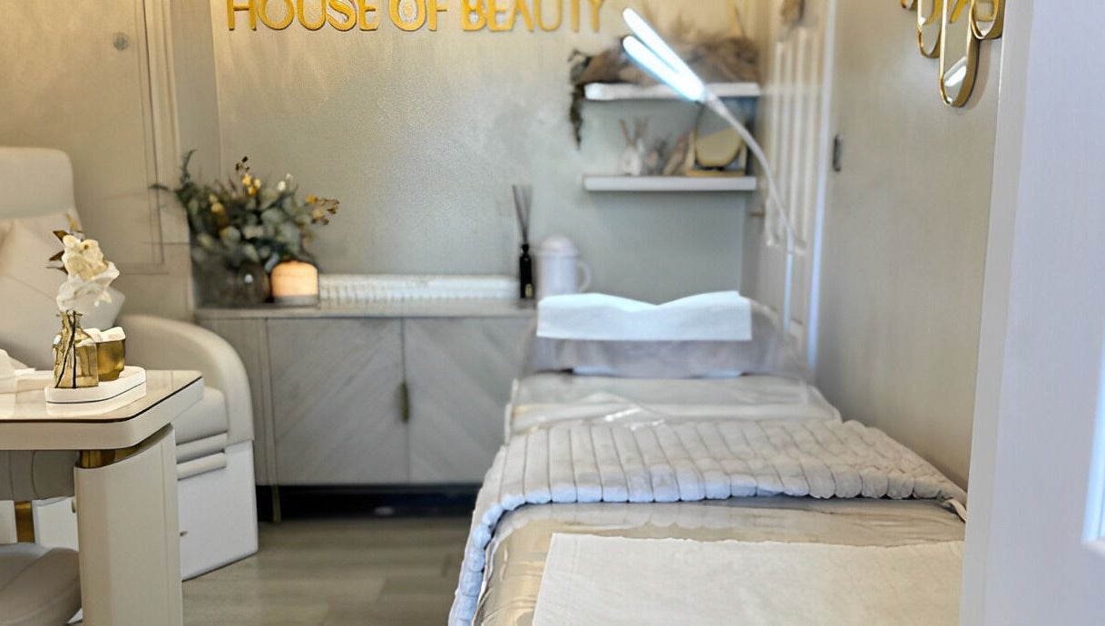 Tranquil treatment room at The House of Beauty, Crowle, England, GB with soothing decor and plush bedding.