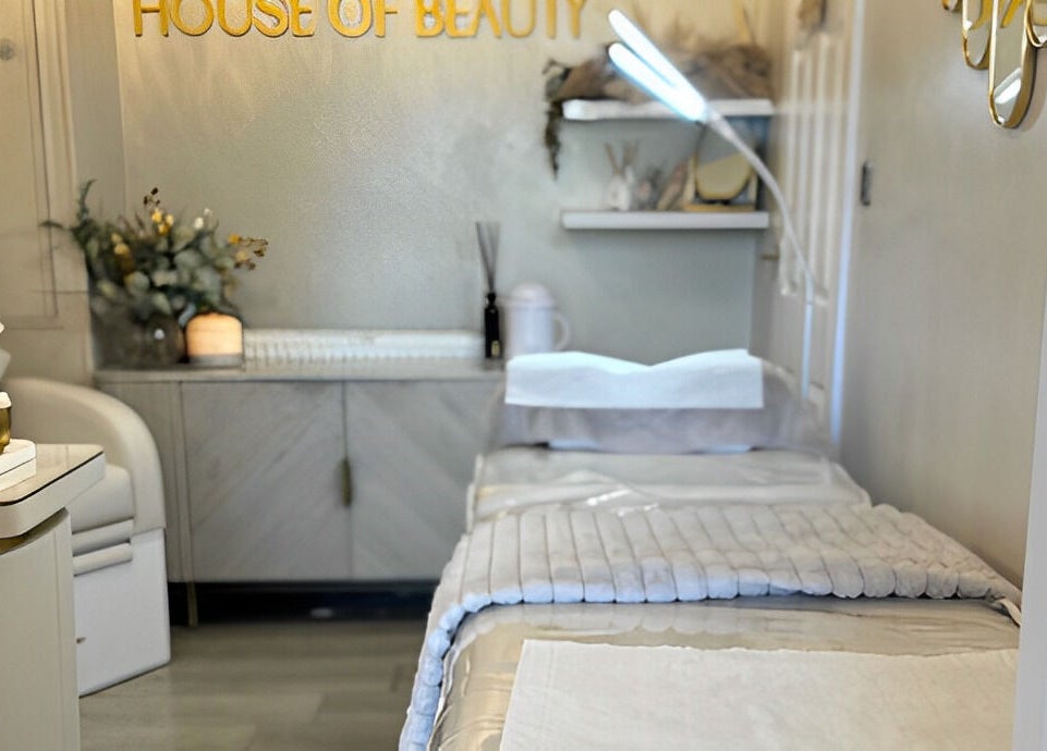 Tranquil treatment room at The House of Beauty, Crowle, England, GB with soothing decor and plush bedding.