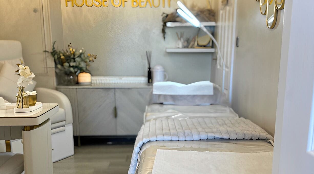 Tranquil treatment room at The House of Beauty, Crowle, England, GB with soothing decor and plush bedding.