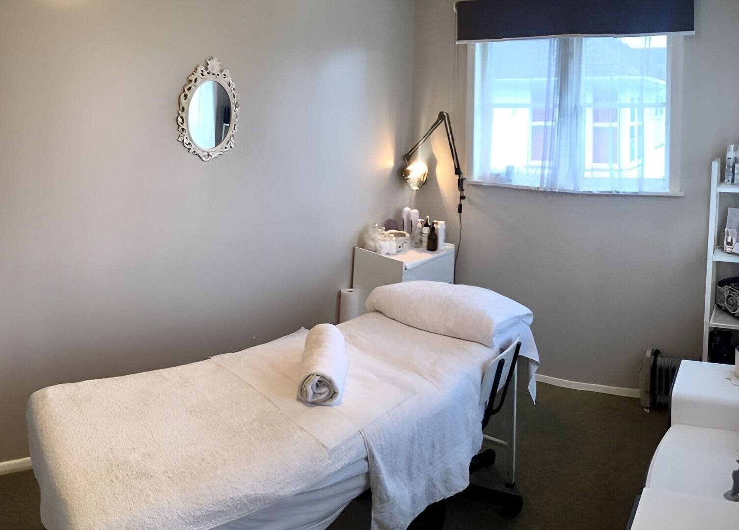 Cozy massage room at Studio M, Horsham Downs, Waikato, NZ, featuring a treatment bed and calming decor.