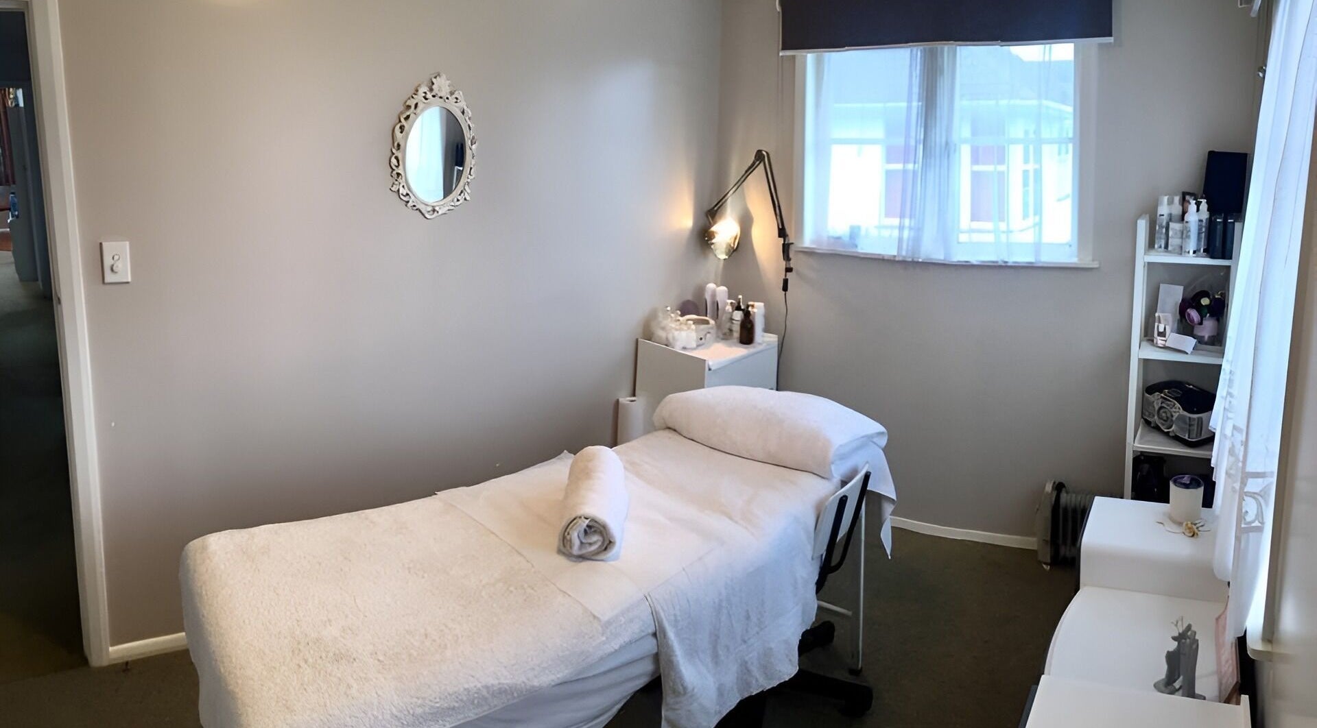 Cozy massage room at Studio M, Horsham Downs, Waikato, NZ, featuring a treatment bed and calming decor.