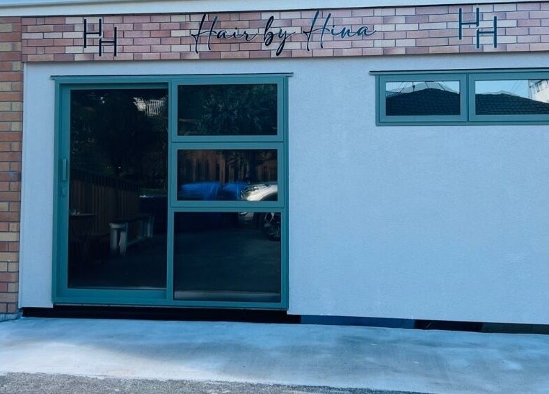Stylish facade of Hair by Hina Limited at Auckland, Auckland, NZ featuring modern glass design.