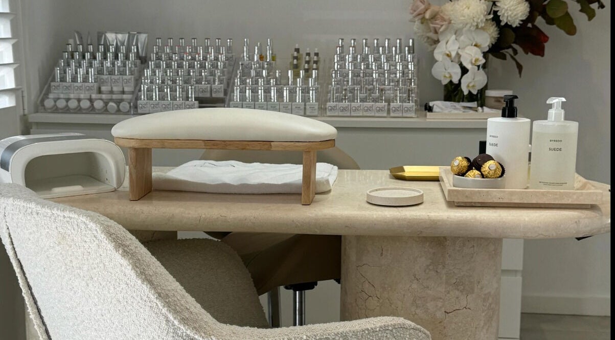 Nail station at Suede Nail Studio, Miranda, New South Wales, AU with products and decor.