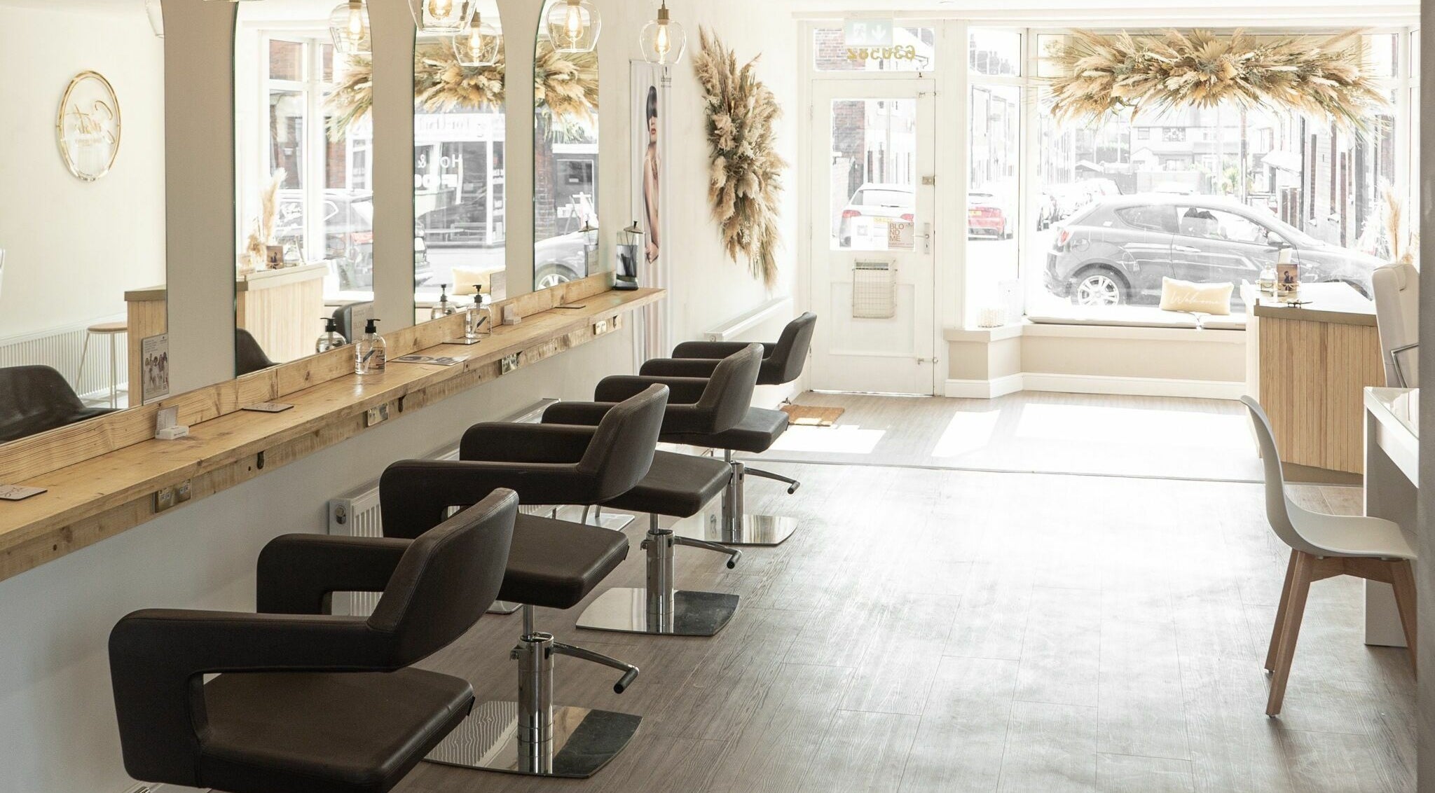 Modern interior of Sista Hair and Beauty ltd in Newcastle-under-lyme, England, GB with stylish salon chairs.