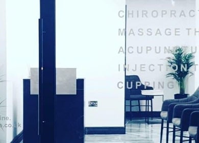 Optimum Physio's modern waiting area with chairs in Birmingham, England, GB. Calm environment for therapy.