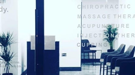 Optimum Physio's modern waiting area with chairs in Birmingham, England, GB. Calm environment for therapy.