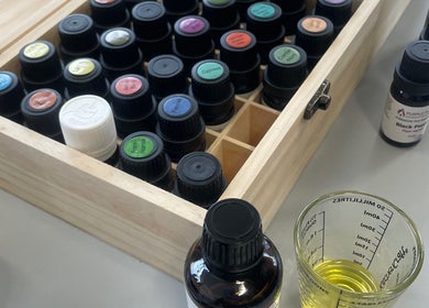 Open box of essential oils at Nataliia’s Massage, Abergavenny, Wales, GB, showcasing relaxation and wellness.