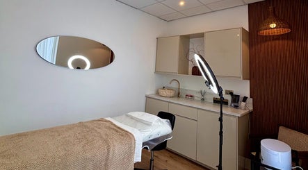 Relaxing treatment room at Brow Inked, Ellesmere Port, England, GB, with modern décor and essential equipment.