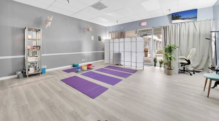 Spacious yoga room with mats at Spa Wellness Services, Greenacres, Florida, US, offering a calm retreat.