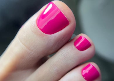 Pink pedicure at KBB Beauty Bar in London, England, GB showcases expert nail care and vibrant style.