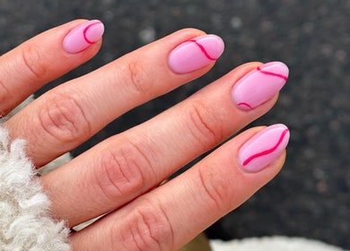 Elegant pink nail art with red lines at KBB Beauty Bar, London, England, GB.