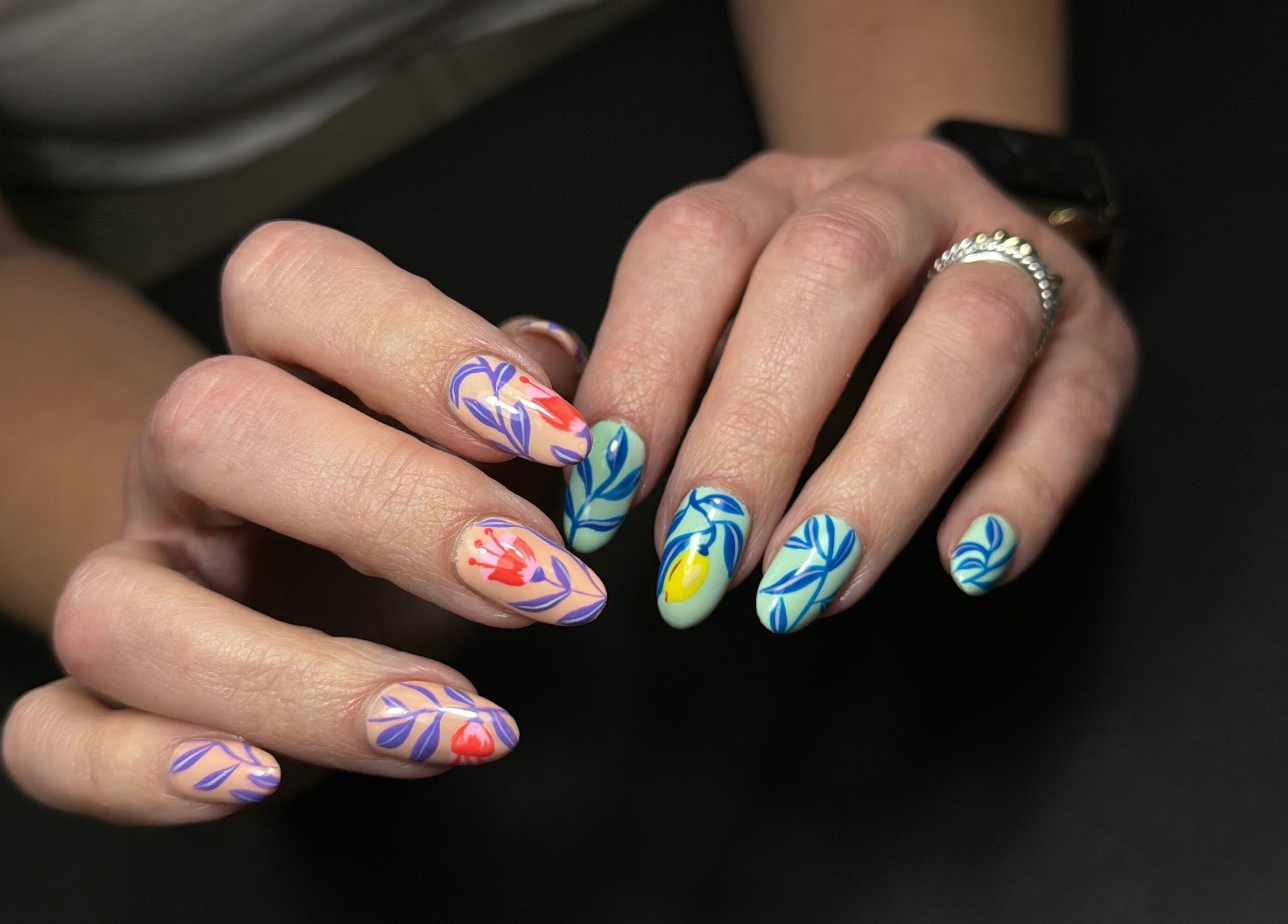 Detailed floral nail art at Nails Lab, Calgary, Alberta, CA showcases exquisite creativity and style.