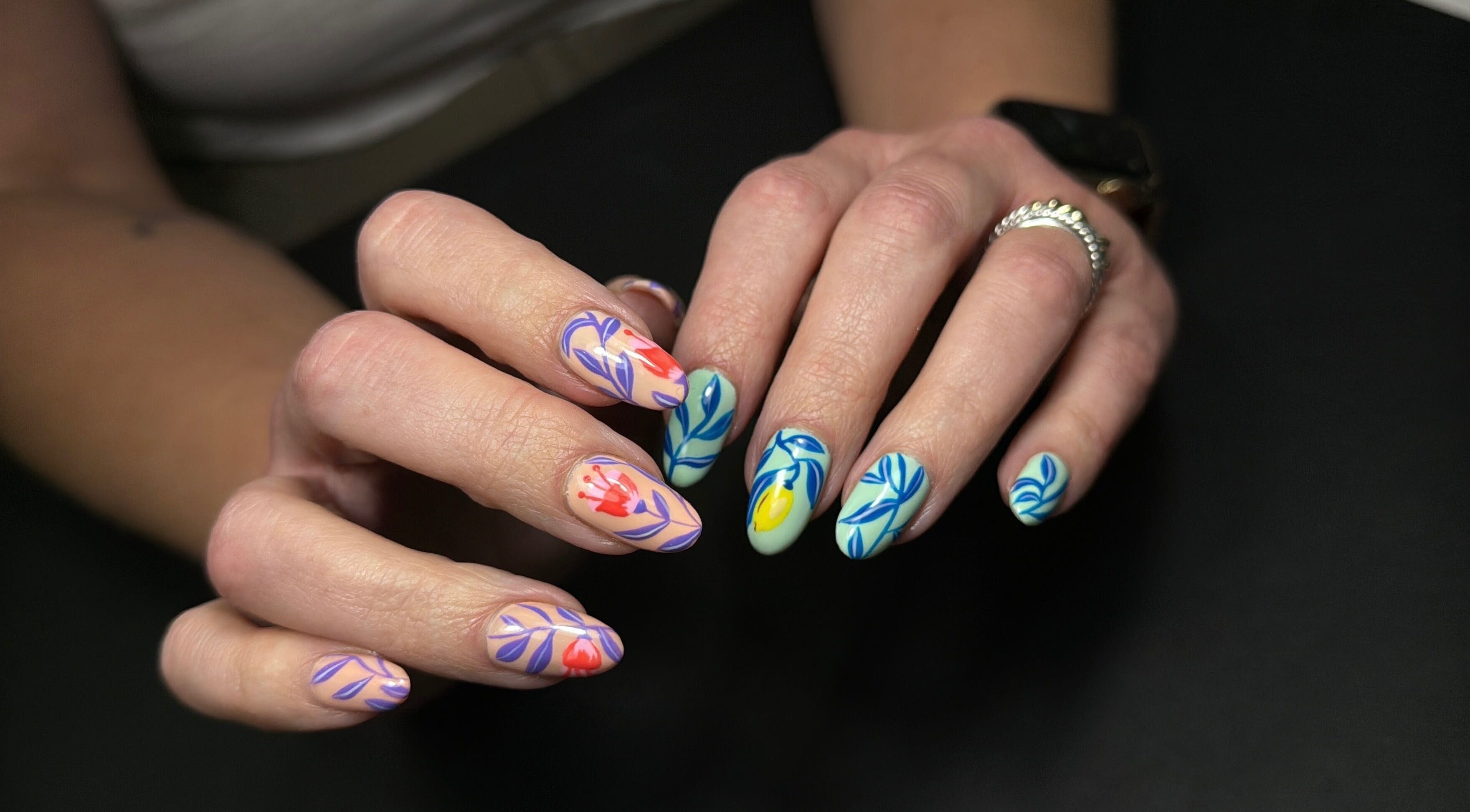 Detailed floral nail art at Nails Lab, Calgary, Alberta, CA showcases exquisite creativity and style.