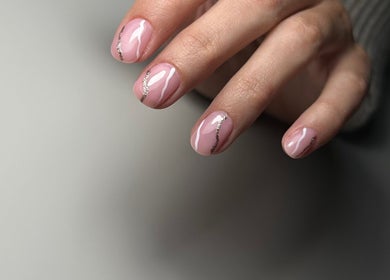 Elegant pink nails with silver accents at Nails Lab, Calgary, Alberta, CA. Perfect manicure for a chic look.