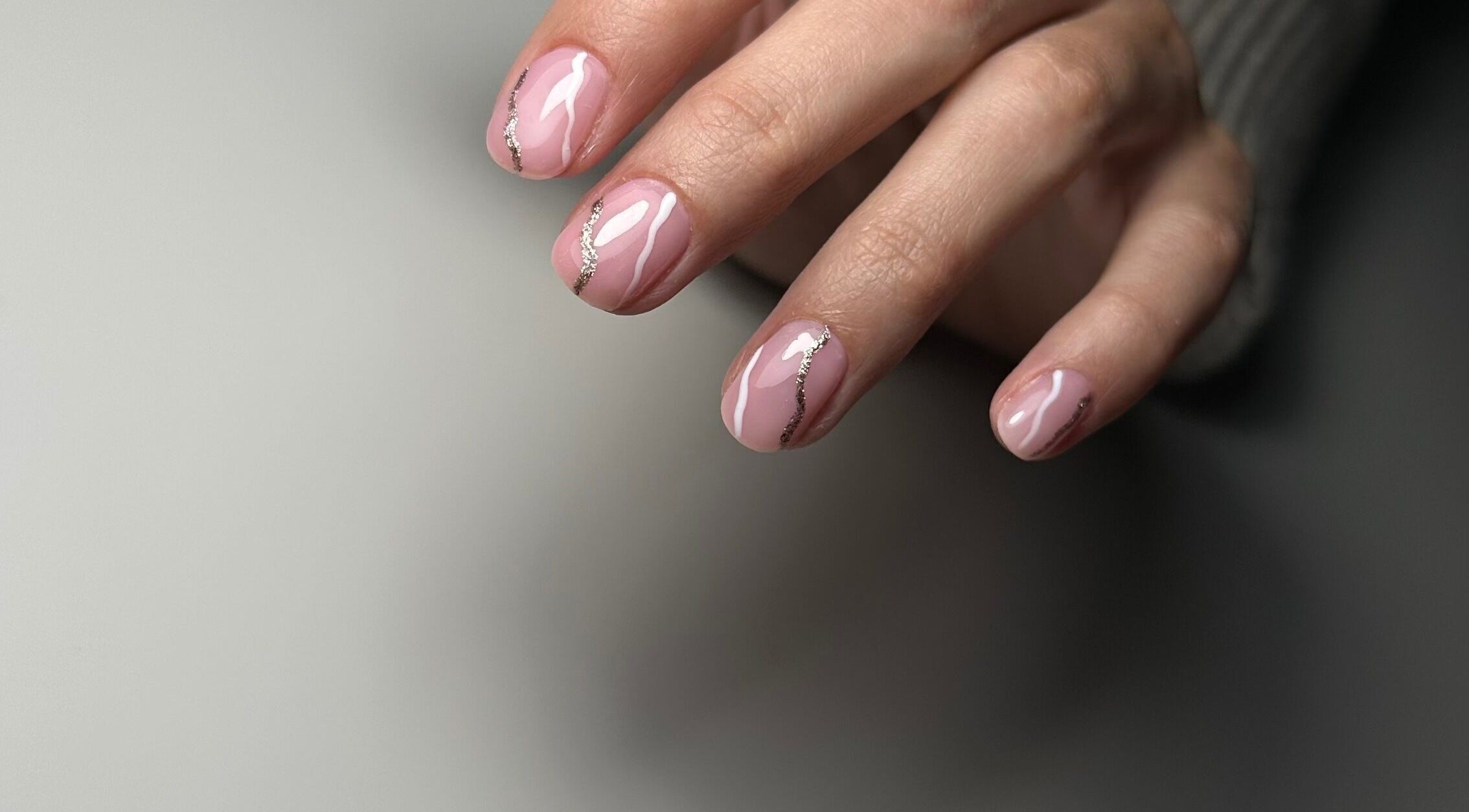 Elegant pink nails with silver accents at Nails Lab, Calgary, Alberta, CA. Perfect manicure for a chic look.