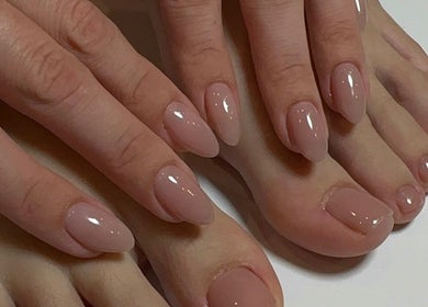 Manicured hands and pedicured feet with nude polish at Nails Lab, Calgary, Alberta, CA.