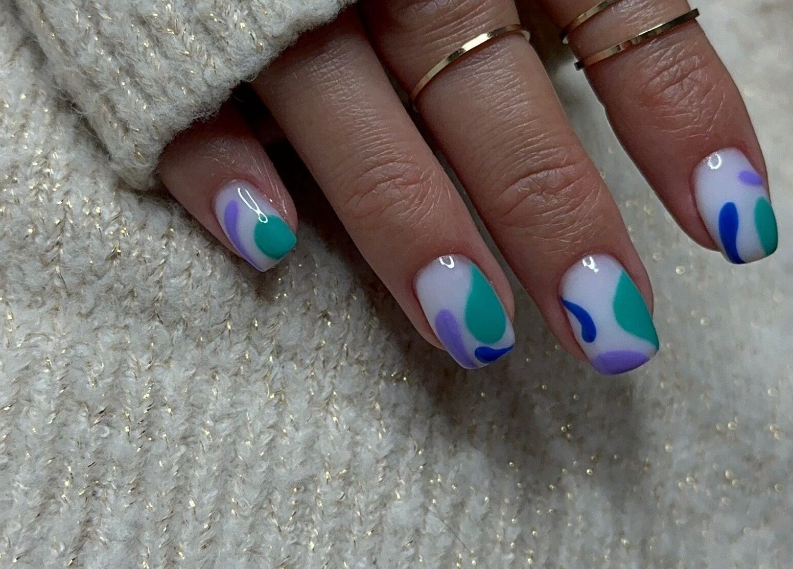 Stylish abstract nail art at Nails Lab, Calgary, Alberta, CA. Showcase of modern design and creativity.