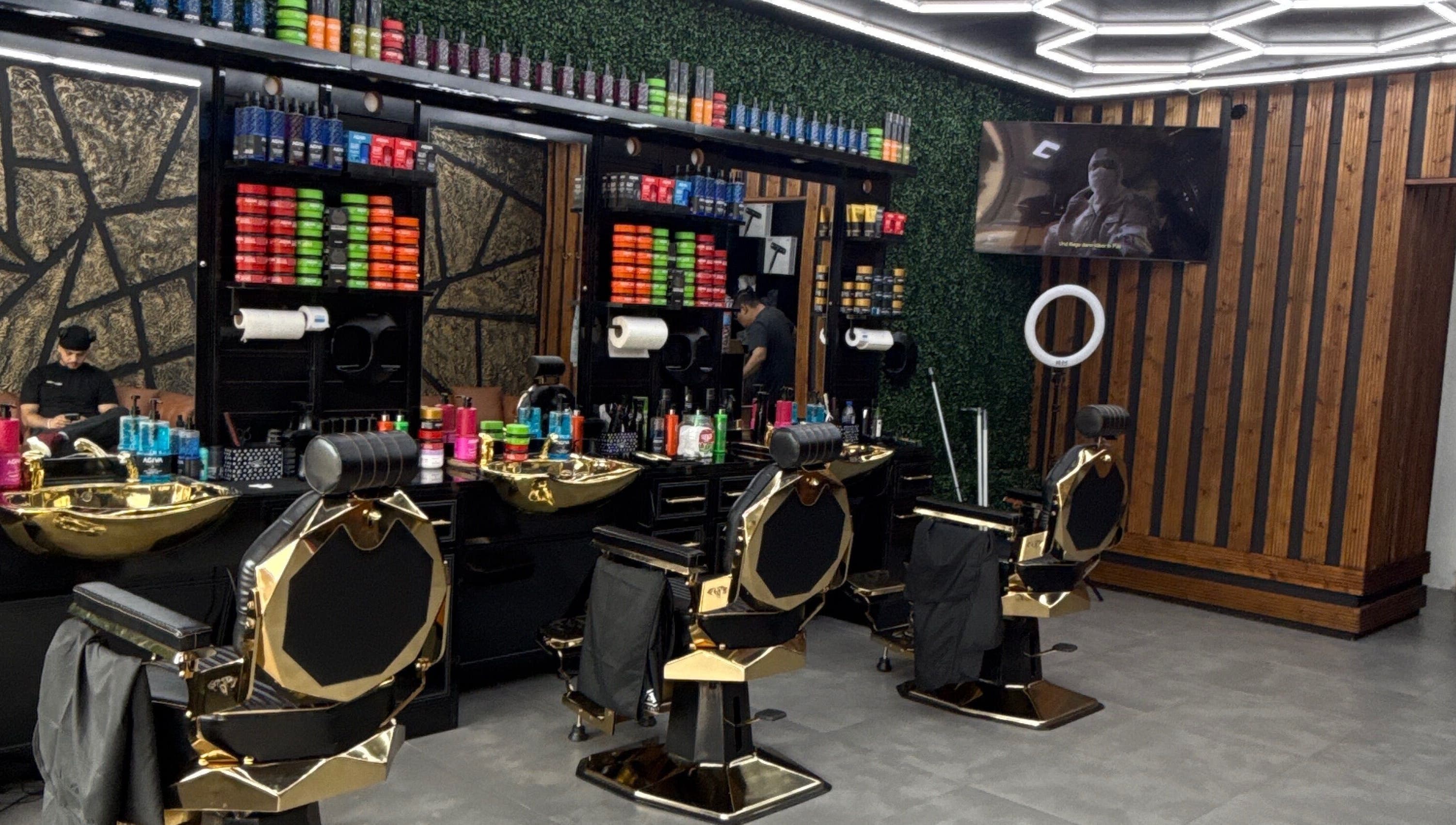 Sleek salon interior of OTF in Coventry, England, GB, featuring plush chairs and colorful products.