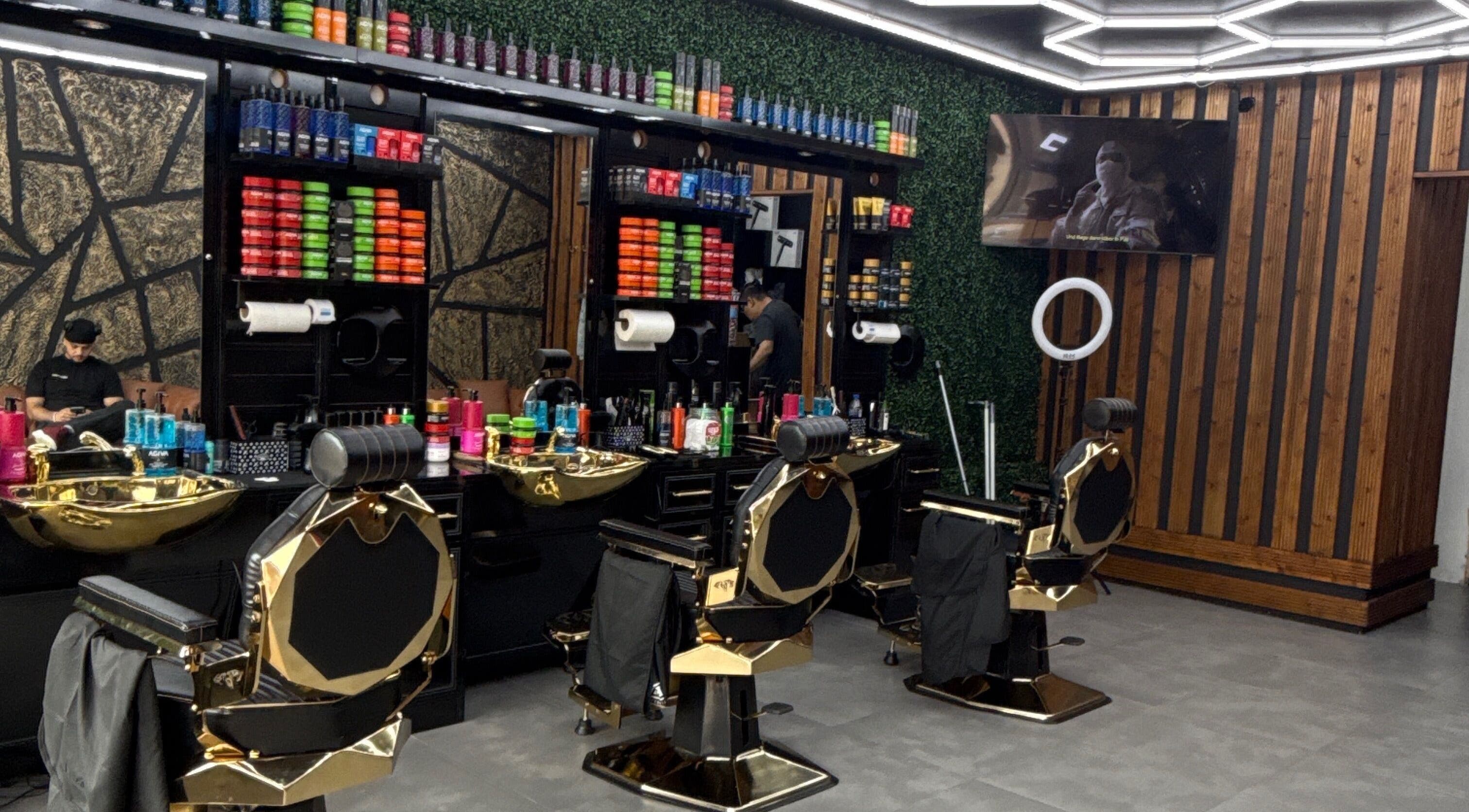 Sleek salon interior of OTF in Coventry, England, GB, featuring plush chairs and colorful products.
