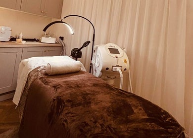 Treatment room at Beam Beauty Studio, Tamworth, England, GB with massage bed and equipment for wellness services.