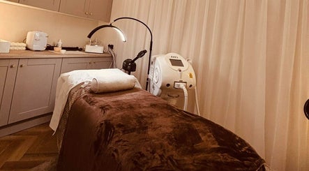 Treatment room at Beam Beauty Studio, Tamworth, England, GB with massage bed and equipment for wellness services.