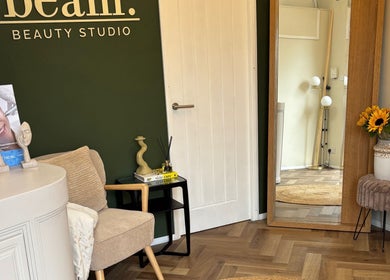 Cozy corner in Beam Beauty Studio, Tamworth, England, GB with stylish seating and decor.