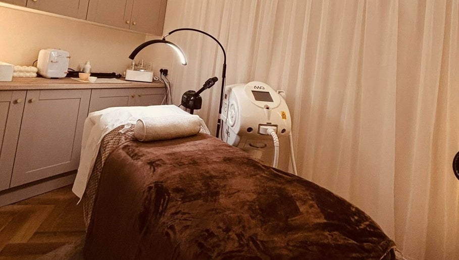 Relaxing treatment room at Beam Beauty Studio, Tamworth, England, GB, with spa bed and equipment.