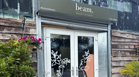 Entrance to Beam Beauty Studio in Tamworth, England, GB with floral decor and artistic door design.