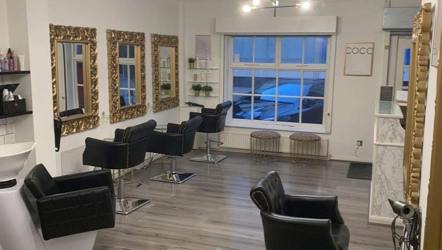 AE HAIR salon interior with elegant mirrors and chairs, Grimsby, England, GB.