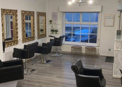 AE HAIR salon interior with elegant mirrors and chairs, Grimsby, England, GB.