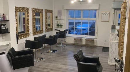 AE HAIR salon interior with elegant mirrors and chairs, Grimsby, England, GB.