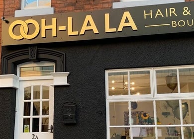 Entrance of AE HAIR, a chic hair and beauty boutique in Grimsby, England, GB, showcasing modern design.