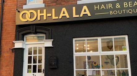 Entrance of AE HAIR, a chic hair and beauty boutique in Grimsby, England, GB, showcasing modern design.