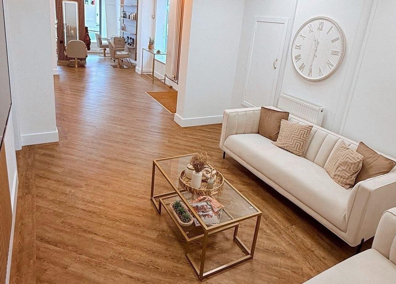 Chic interior of AE HAIR in Grimsby, England, GB featuring stylish sofas and modern design.