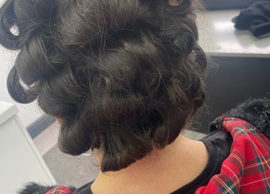 Elegant curled hairstyle at CMA GLAM&TAN, Chadderton, England, GB, showcasing intricate hair design.