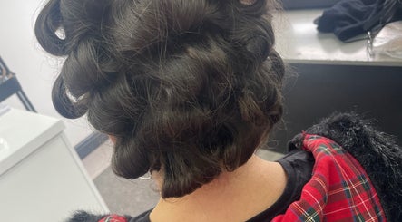 Elegant curled hairstyle at CMA GLAM&TAN, Chadderton, England, GB, showcasing intricate hair design.