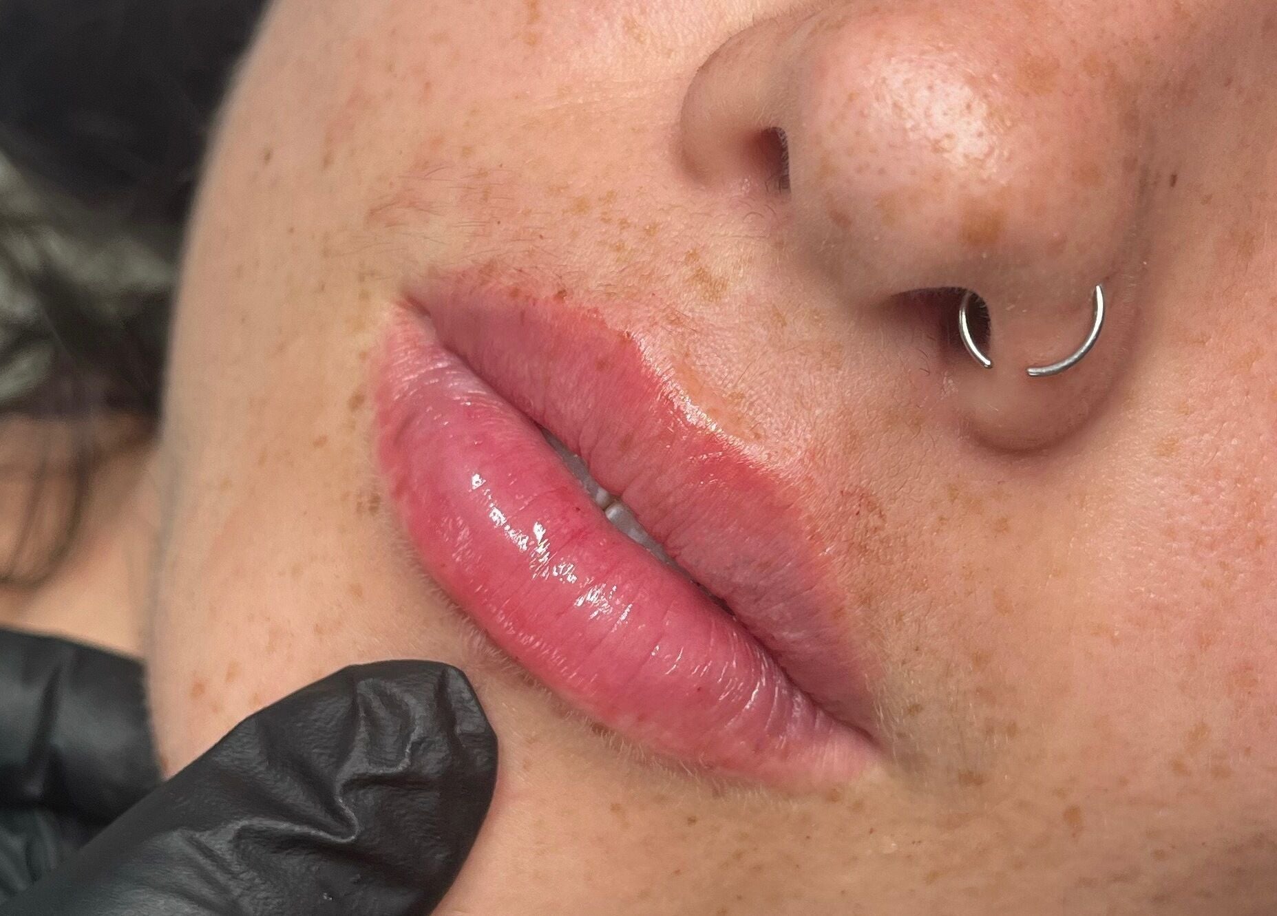 Close-up of glossy lips at TweaksByMia, Colchester, England, GB.